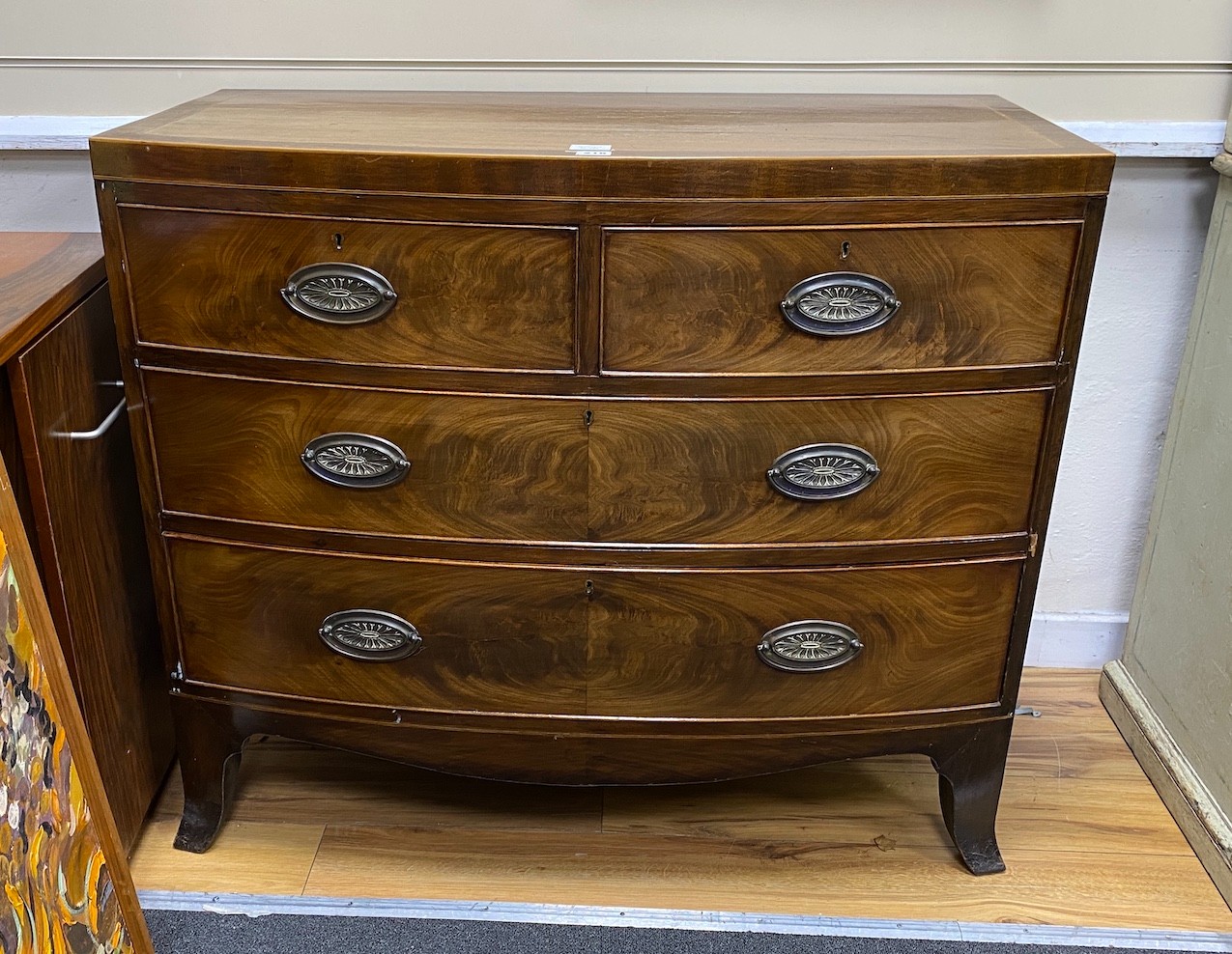 A Regency banded mahogany bow fronted chest of drawers, width 103cm, depth 52cm, height 89cm